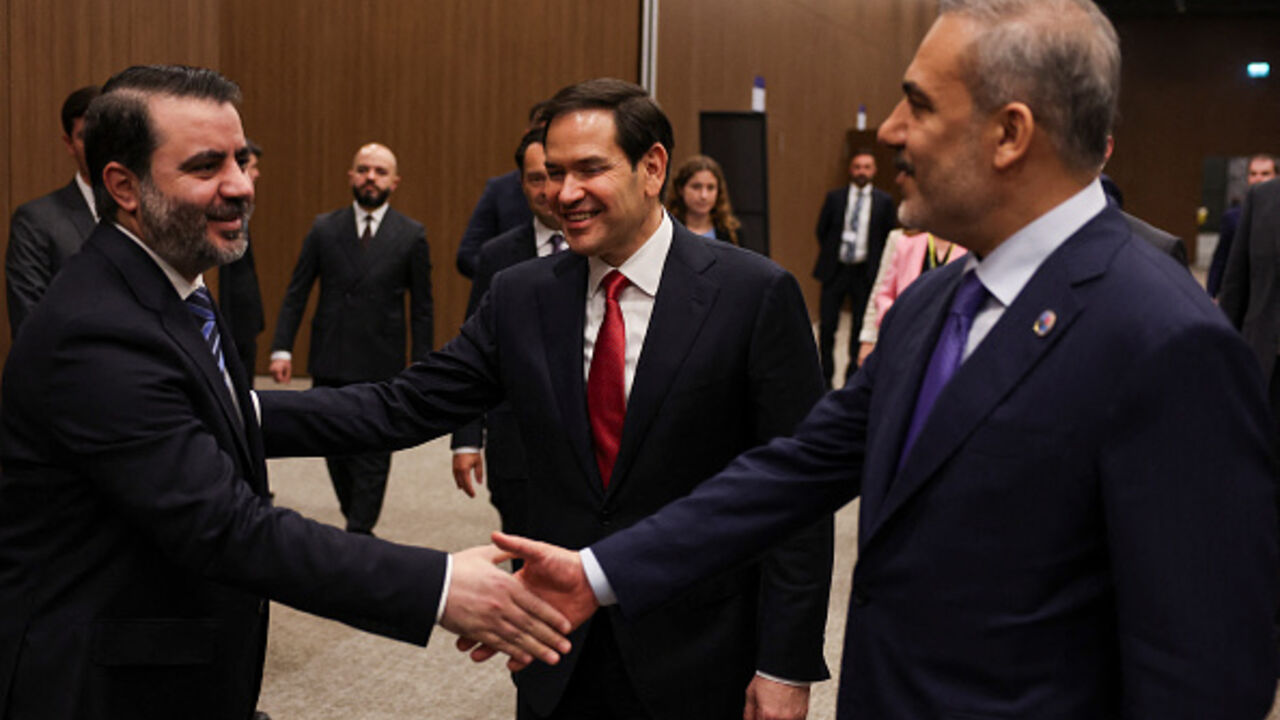 Turkish Foreign Minister Hakan Fidan (R) shakes hands with Syrian Foreign Minister Asaad Hassan al-Shibani and US Secretary of State Marco Rubio (C) at the NEST International Convention Center, in Antalya on May 15, 2025. (UMIT BEKTAS/AFP via Getty Images)