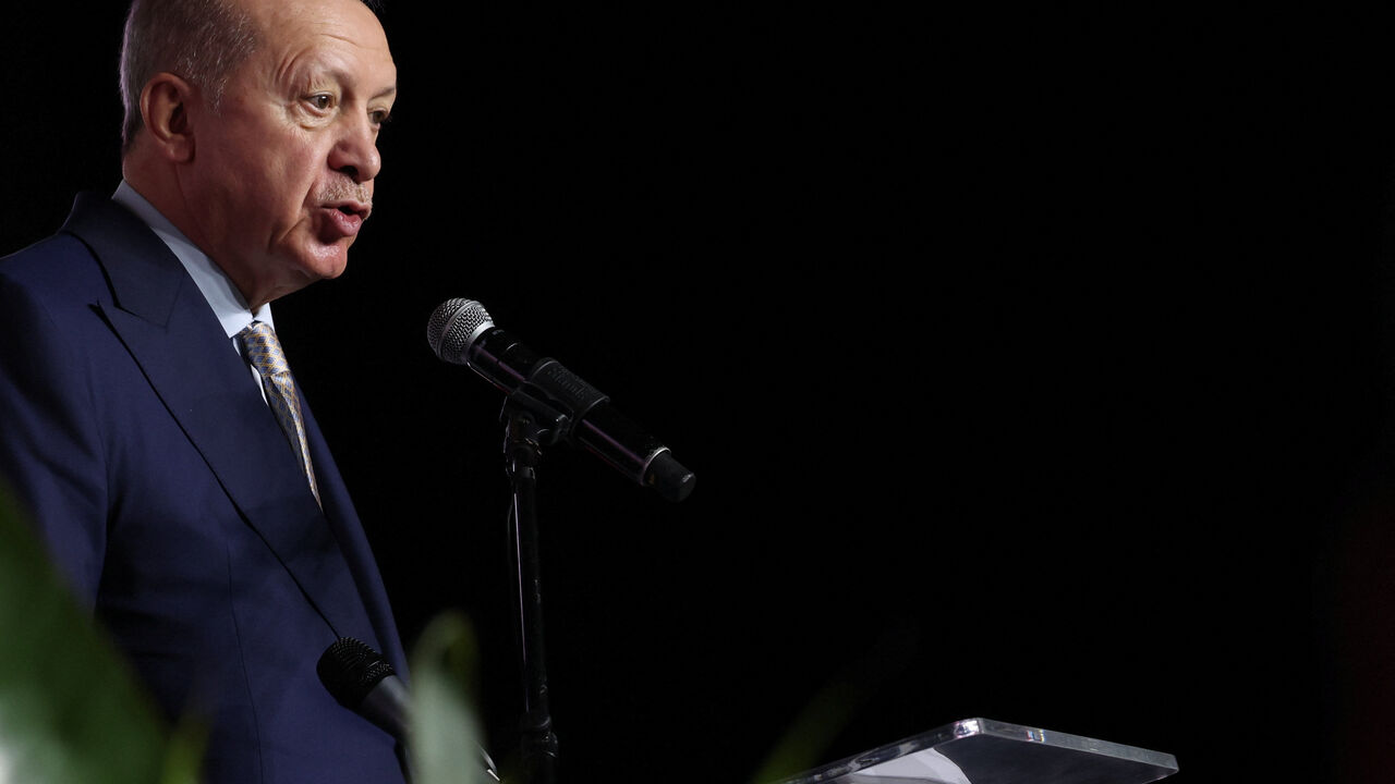 Turkey's President Tayyip Erdogan speaks to the media at the end of the G20 Leaders' Summit in Johannesburg, South Africa, November 23, 2025. REUTERS/Sodiq Adelakun
