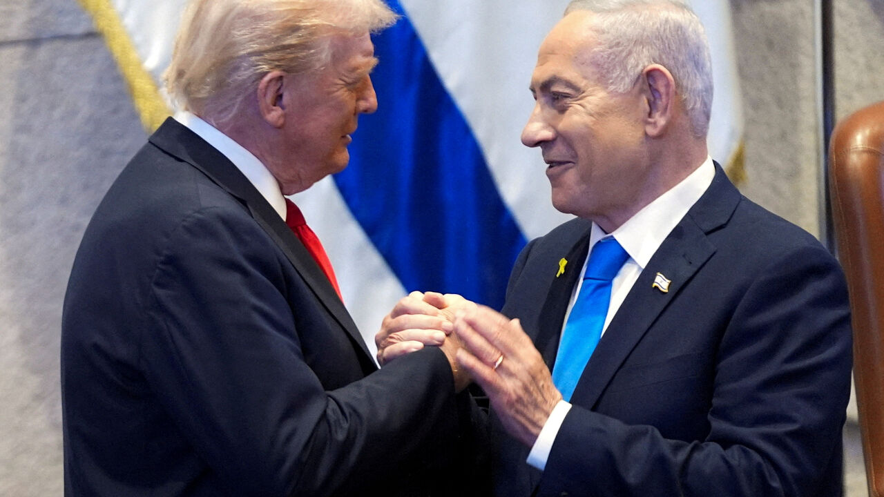 President Donald Trump talks with Israel's Prime Minister Benjamin Netanyahu at the Knesset, Monday, Oct. 13, 2025, in Jerusalem. Evan Vucci/Pool via REUTERS