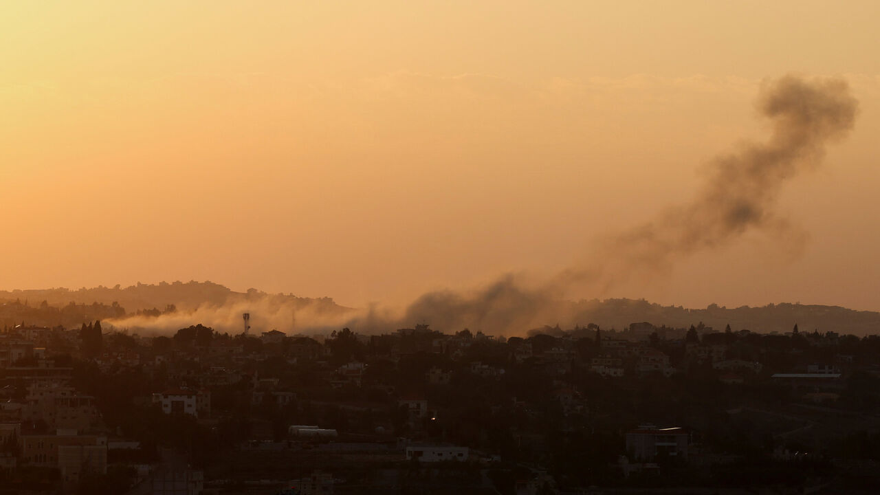Smoke rises over Baraashit after Israel's military said it struck targets in two southern Lebanese towns on Thursday, as taken from Houla, a village near the border with Israel, southern Lebanon, December 4, 2025. REUTERS/Aziz Taher
