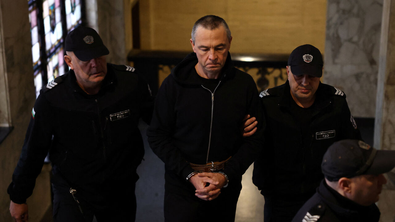 Igor Grechushkin, a Russian businessman based in Cyprus, is escorted by police before the start of his trial on the possible extradition to Lebanon, in Sofia, Bulgaria, December 10, 2025. REUTERS/Stoyan Nenov