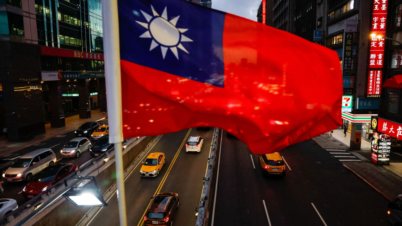 A Taiwan flag can be seen on an overpass ahead of National Day celebrations in Taipei, Taiwan, October 8, 2025. REUTERS/Ann Wang