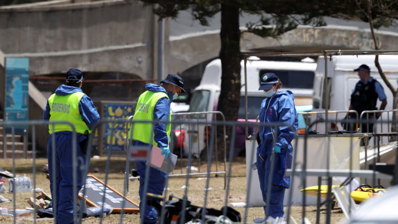 Members of the forensic team work at the scene of a shooting during a Jewish holiday celebration at Bondi Beach, in Sydney, Australia, December 15, 2025. REUTERS/Hollie Adams