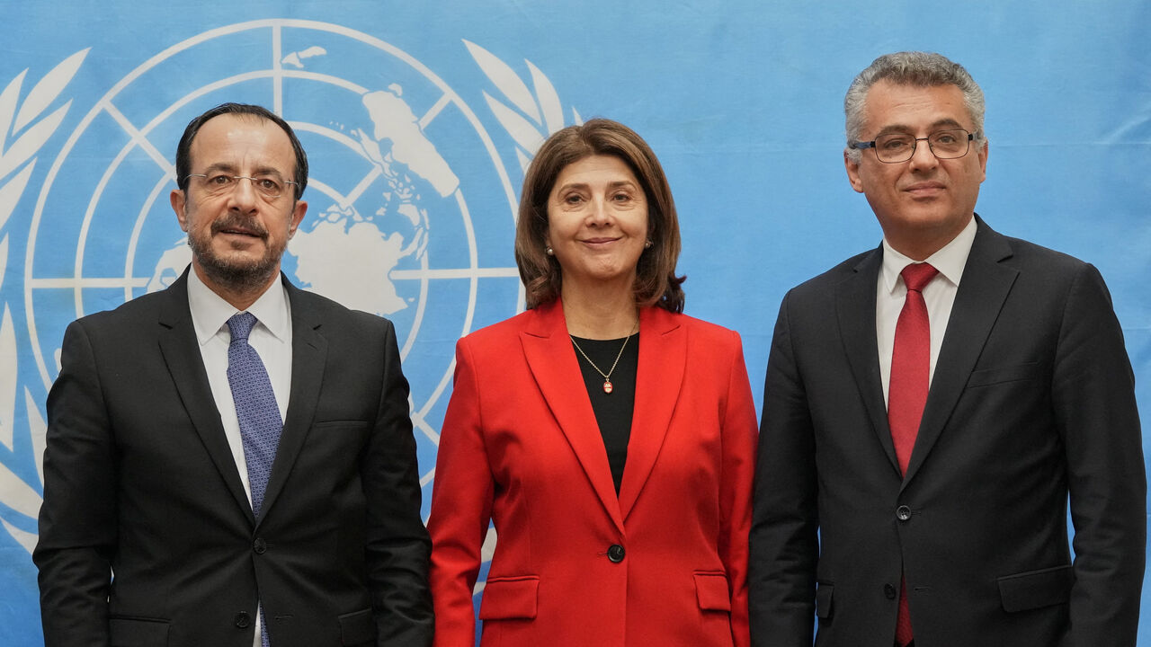 Republic of Cyprus President Nikos Christodoulides, United Nations Secretary-General's Personal Envoy on Cyprus, Maria Angela Holguin Cuellar, and  Turkish Cypriot leader Tufan Erhurman pose for a photograph  at the U.N. compound inside the UN buffer zone, in Nicosia, Cyprus, December 11, 2025. Petros Karadjias/Pool via REUTERS