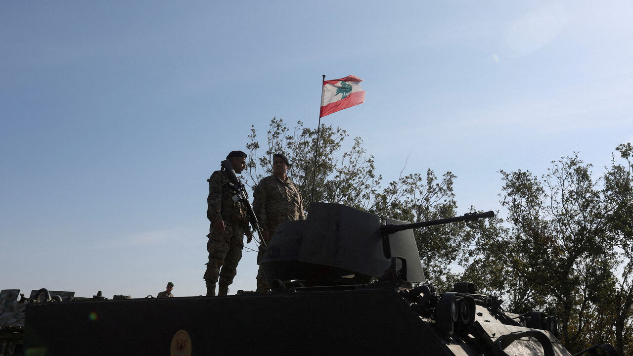 FILE PHOTO: Lebanese army members stand on a military vehicle during a Lebanese army media tour, to review the army's operations in the southern Litani sector, in Alma Al-Shaab, near the border with Israel, southern Lebanon, November 28, 2025. REUTERS/Aziz Taher/File Photo