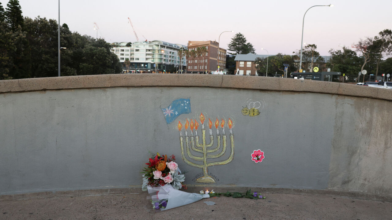 Flowers lie on the bridge as the crime scene was reopened following the mass shooting at Bondi Beach on Sunday, in Sydney, Australia, December 19, 2025. REUTERS/Hollie Adams