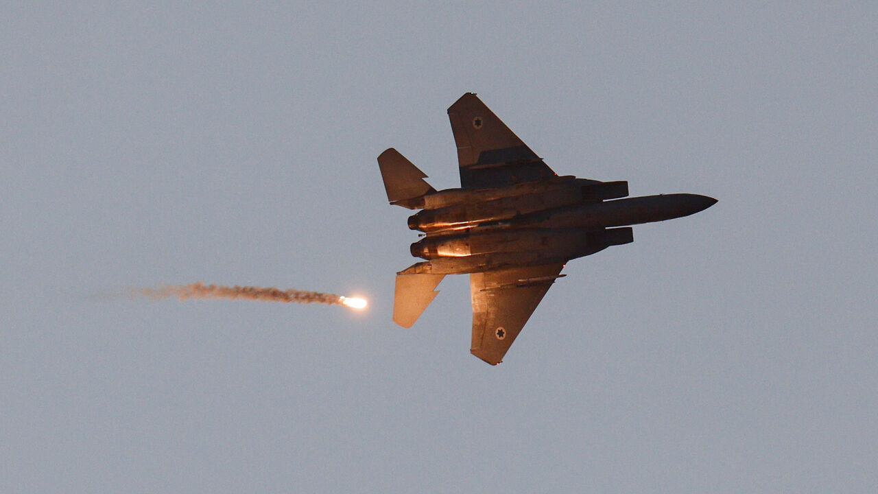 An F-15 jet releases a flare as it flies over Gaza, as seen from the Israeli side of the Israel-Gaza border, July 20, 2025. REUTERS/Amir Cohen