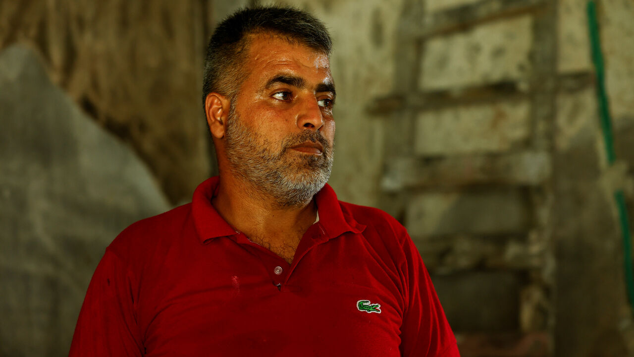 Osama Twayyer looks at his burned room in his house in the countryside of Jableh, Latakia, Syria September 17, 2025. REUTERS/Yamam Al Shaar