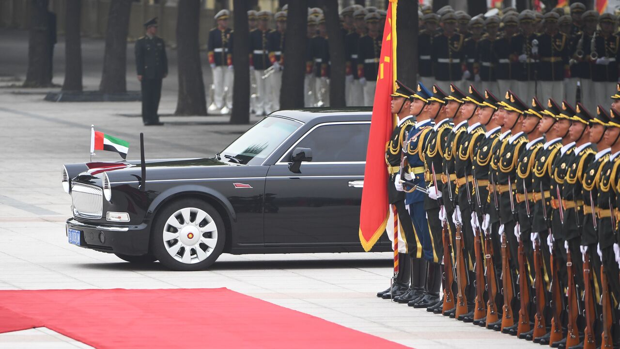 The Red Flag limousine carrying Abu Dhabi Crown Prince Mohammed bin Zayed passes a military honour guard as he arrives for a welcoming ceremony outside the Great Hall of the People in Beijing on July 22, 2019. (Photo by GREG BAKER / AFP) (Photo credit should read GREG BAKER/AFP via Getty Images)