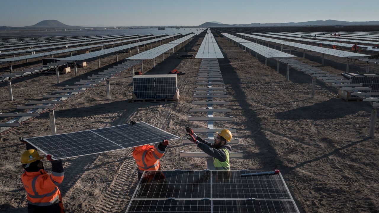 Employees install new solar panels at the Kalyon Energy's Karapinar Solar Power Plant on December 02, 2021 in Karapinar, Turkey. 