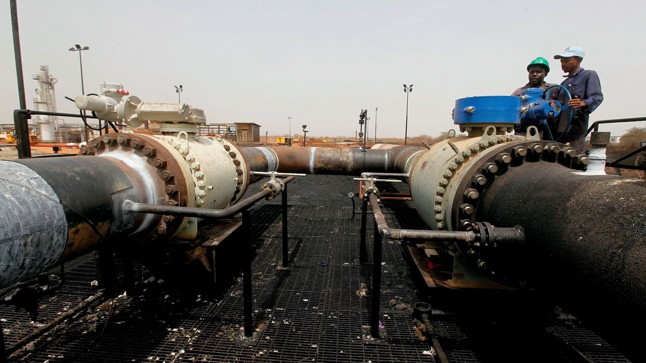 Sudanese repair crew work at the Heglig oil facility, after Sudan started pumping oil again from the war-damaged oil field on May 2, 2012, 12 days after occupying South Sudanese troops left the area. 