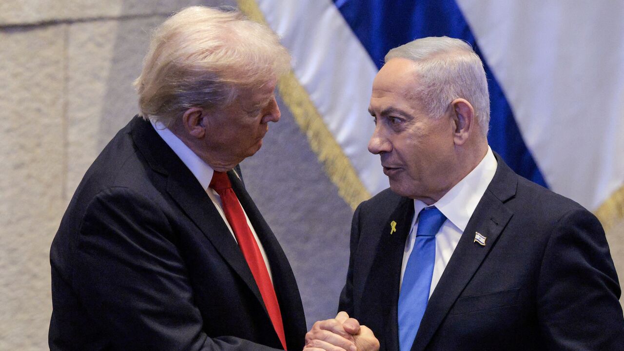 US President Donald Trump speaks with Israeli Prime Minister Benjamin Netanyahu at the Israeli parliament, the Knesset, in Jerusalem on Oct. 13, 2025.