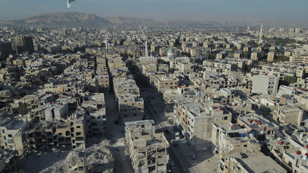 An aerial view shows the destruction across Yarmouk camp, Damascus, Syria, on November 8, 2025. Established in 1957, Yarmouk was once the largest Palestinian refugee community in Syria, but years of conflict left much of it in ruins. (Photo by Omar Albaw / Middle East Images via AFP) (Photo by OMAR ALBAW/Middle East Images/AFP via Getty Images)