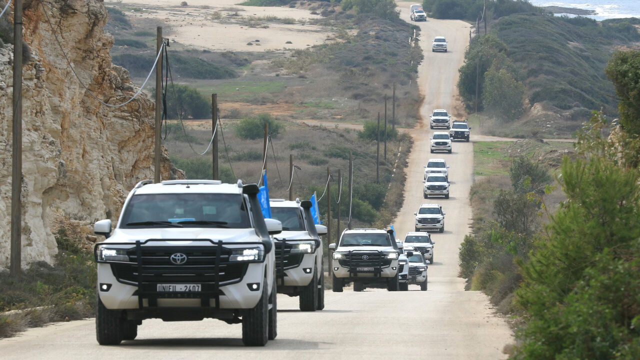 A convoy carrying a UN security council delegation, tours the border with Israel close to the southern Lebanese area of Naqura on December 6, 2025. UNIFIL peacekeepers have been tasked with acting as a buffer between Israel and Lebanon since March 1978, and with monitoring the November 2024 ceasefire that sought to halt more than a year of hostilities between Israel and Hezbollah. (Photo by Mahmoud ZAYYAT / AFP via Getty Images)
