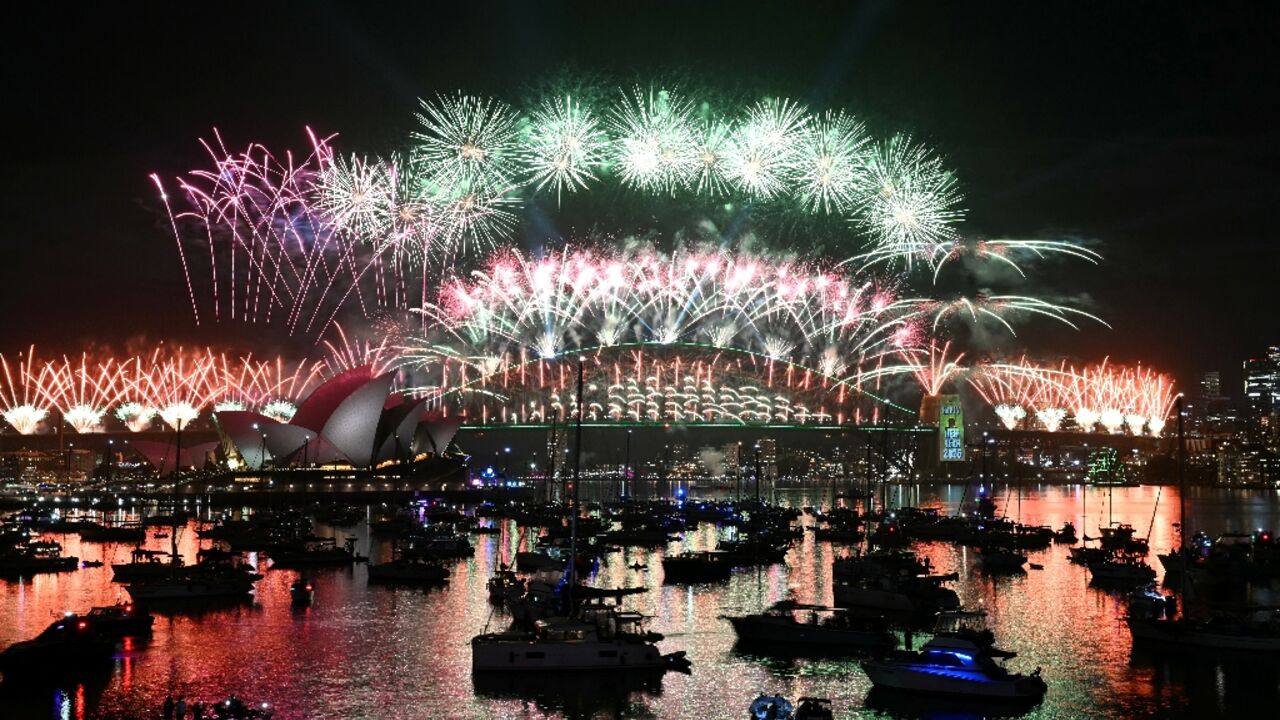 Sydney rang in the New Year with its customary fireworks display after pausing for a minute of silence to honour victims of the Bondi Beach mass shooting barely two weeks earlier