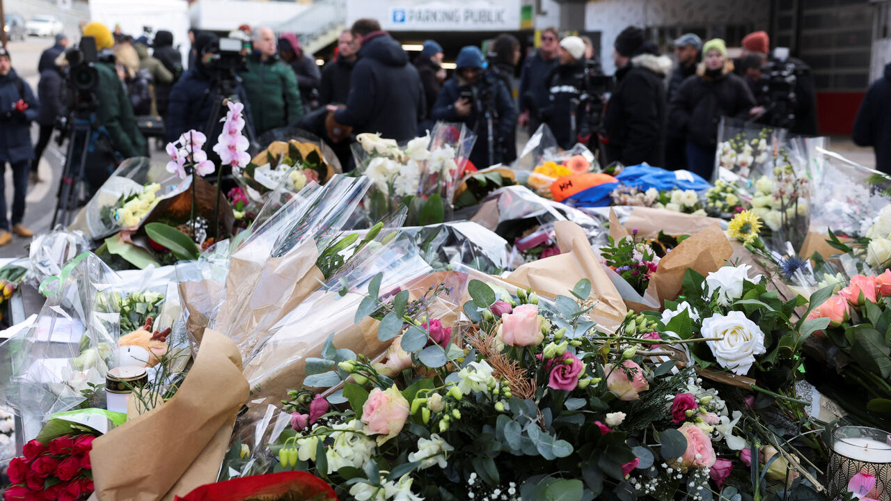 Floral tributes lie outside the "Le Constellation" bar, after a fire and explosion during a New Year's Eve party where people died and others were injured, in the upscale ski resort of Crans-Montana in southwestern Switzerland, January 2, 2026. REUTERS/Stephanie Lecocq