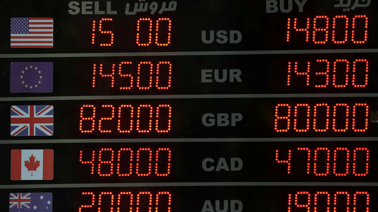 FILE PHOTO: A sign at a currency exchange, as the value of the Iranian Rial drops, in Tehran, Iran, December 30, 2025. Majid Asgaripour/WANA (West Asia News Agency) via REUTERS/File Photo