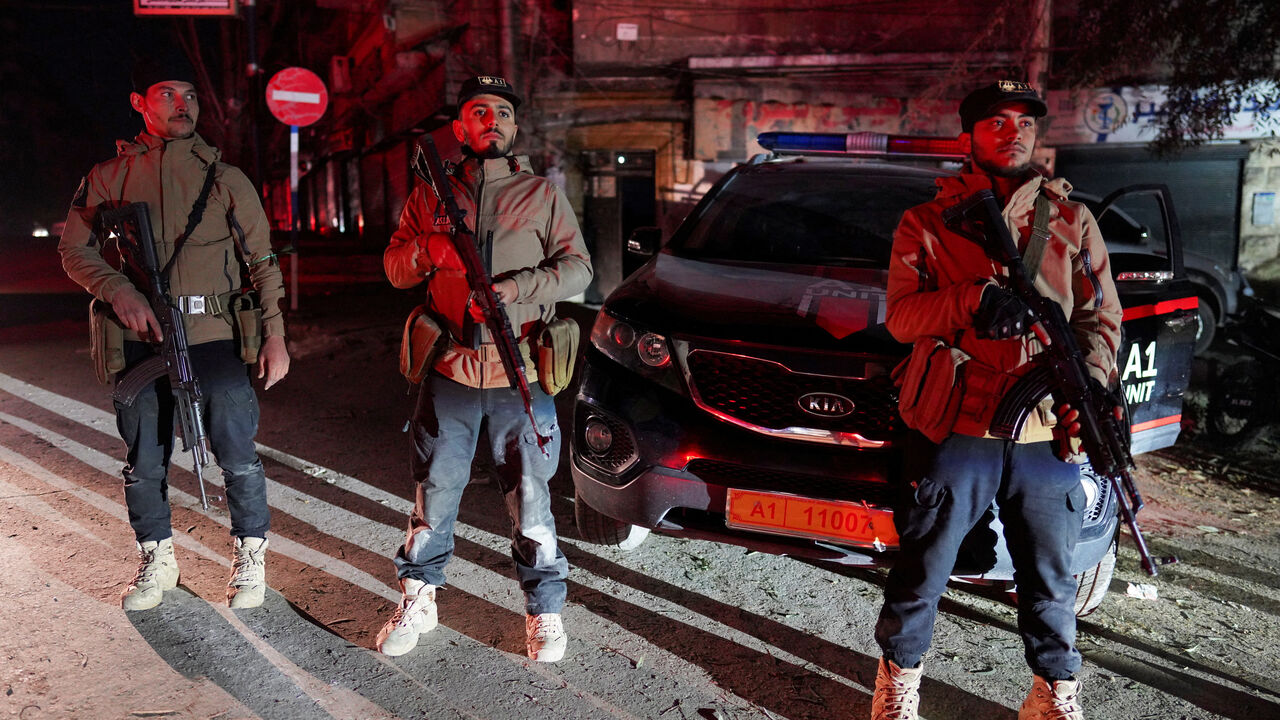 Security forces affiliated with the Ministry of the Interior stand guard in the Ashrafieh neighbourhood, which they have taken control of, according to the Ministry of the Interior, following battles with the Syrian Democratic Forces, in Aleppo, Syria, January 9, 2026. REUTERS/Karam al-Masri