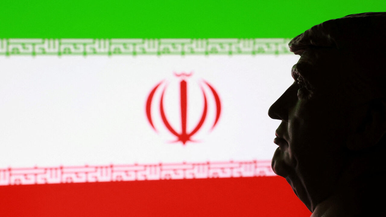 A 3D printed miniature of U.S. President Donald Trump and Iranian flag are seen in this illustration taken January 9, 2026. REUTERS/Dado Ruvic/Illustration