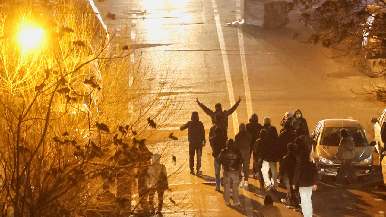 Iranian demonstrators gather in a street during a protest over the collapse of the currency's value, in Tehran, Iran, January 8, 2026. Stringer/WANA (West Asia News Agency) via REUTERS