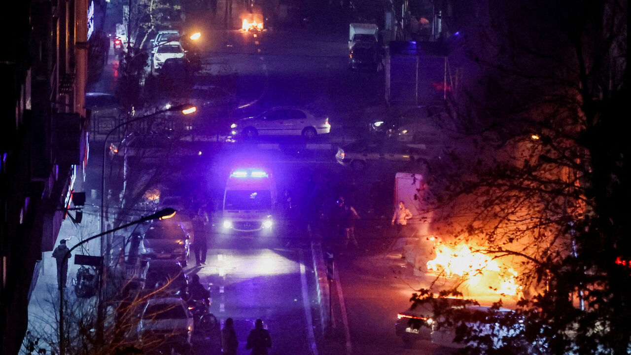 Cars burn in a street during a protest over the collapse of the currency's value, in Tehran, Iran, January 8, 2026. Stringer/WANA (West Asia News Agency) via REUTERS/File Photo