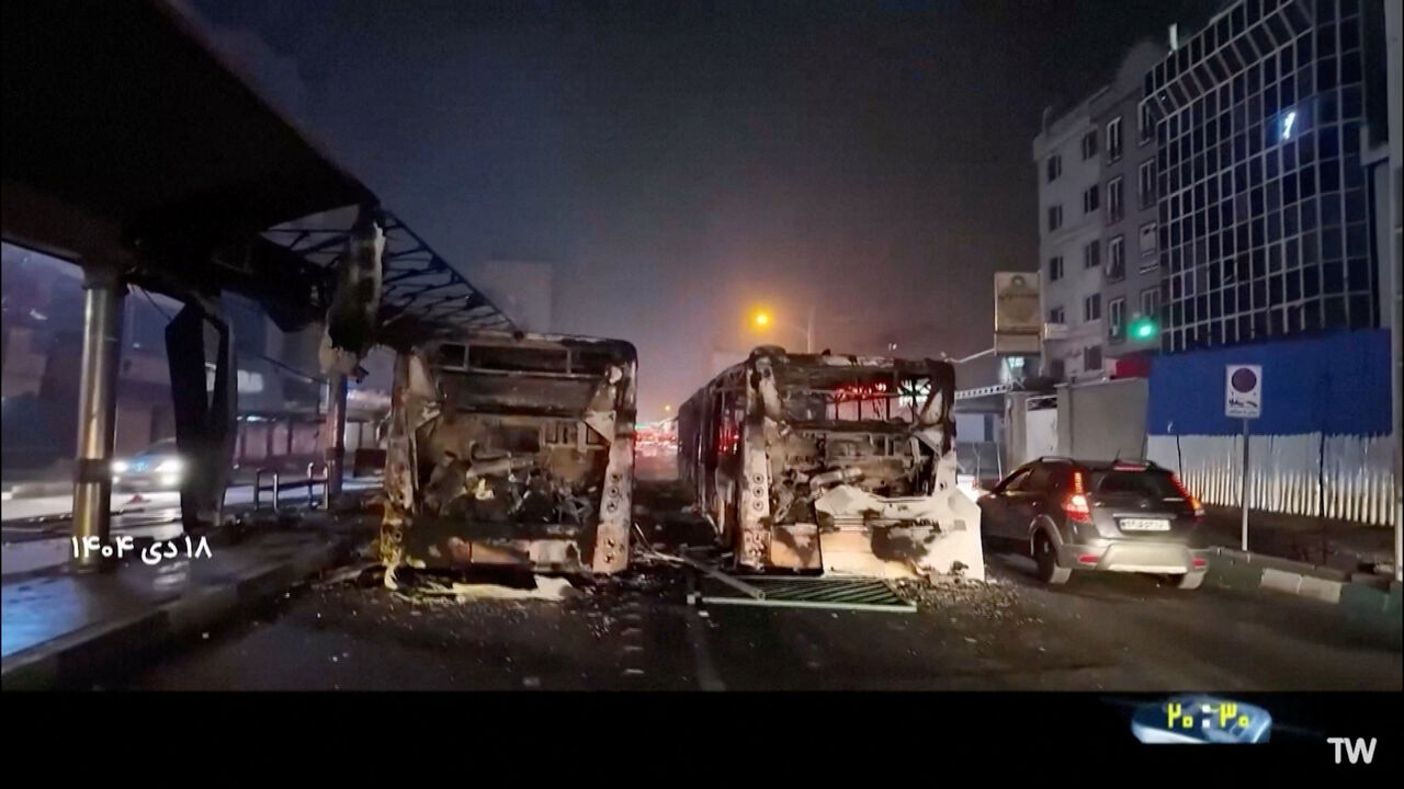 Burnt vehicles lie on the road following unrest sparked by dire economic conditions, in a place given as Tehran, Iran, January 10, 2026, in this screengrab from Iran's state media broadcast footage. IRIB via WANA(West Asia News Agency) via REUTERS