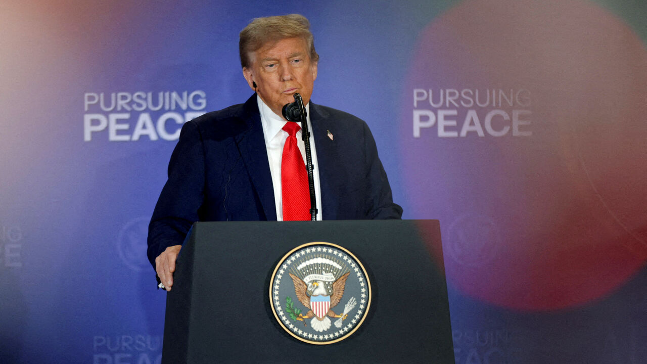 FILE PHOTO: U.S. President Donald Trump holds a press conference with Russian President Vladimir Putin following their meeting to negotiate an end to the war in Ukraine, at Joint Base Elmendorf-Richardson in Anchorage, Alaska, U.S., August 15, 2025. REUTERS/Jeenah Moon/ File Photo