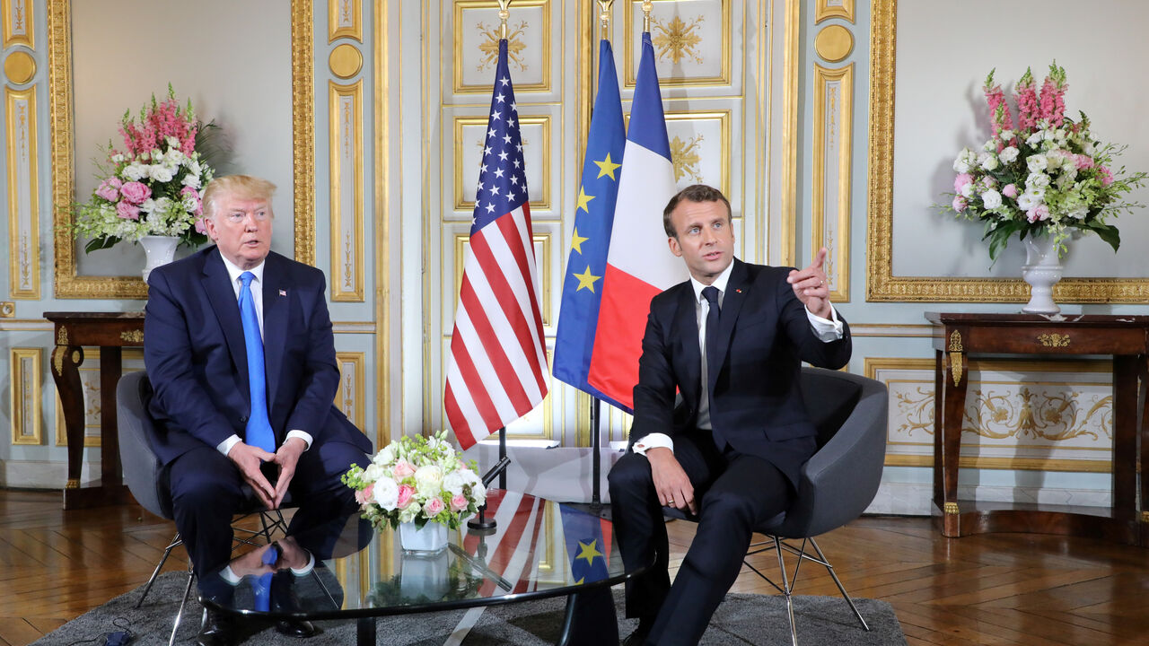 U.S. President Donald Trump and French President Emmanuel Macron speak during a meeting at the Prefecture of Caen, Normandy, France June 6, 2019, on the sidelines of D-Day commemorations marking the 75th anniversary of the World War II Allied landings in Normandy. Ludovic Marin/Pool via REUTERS