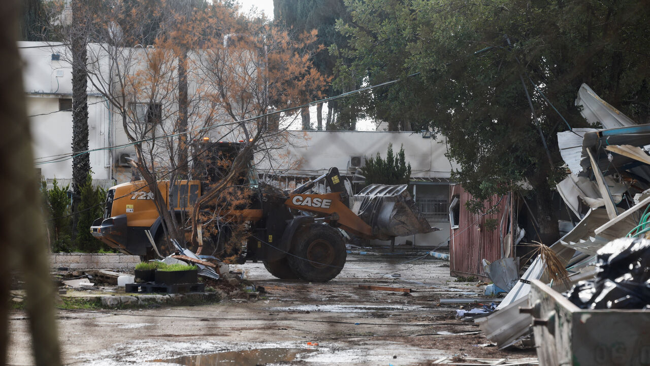 Heavy machinery operates as Israeli forces dismantle the Jerusalem headquarters of the United Nations Relief and Works Agency for Palestine Refugees (UNRWA), in East Jerusalem, January 20, 2026. REUTERS/Ammar Awad