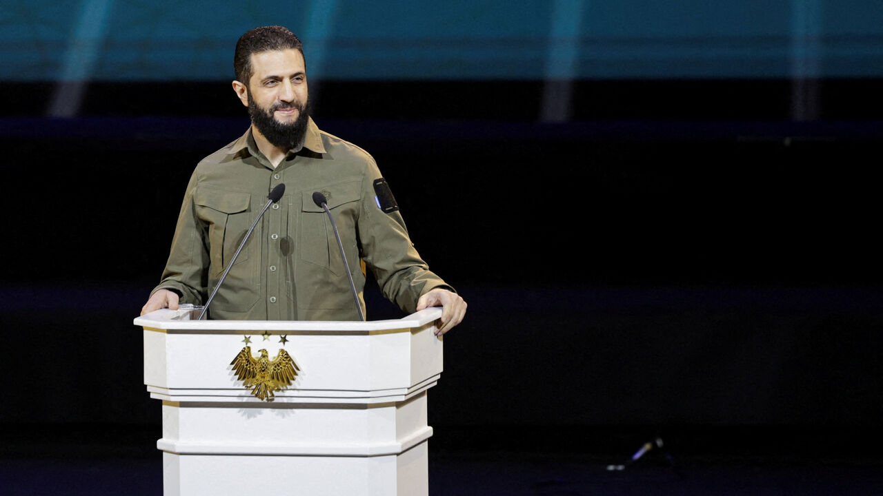 FILE PHOTO: Syria's President Ahmed al-Sharaa delivers a speech on the first anniversary of Bashar al-Assad's fall, in Damascus, Syria December 8, 2025. REUTERS/Khalil Ashawi/File Photo