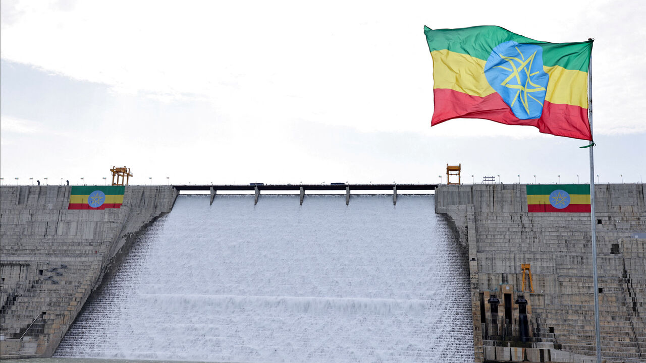 FILE PHOTO: An Ethiopian flag flutters in the wind next to the Grand Ethiopian Renaissance Dam (GERD), built along the Blue Nile, during its inauguration, in Guba, Benishangul-Gumuz region, Ethiopia, September 9, 2025. REUTERS/Tiksa Negeri/File Photo
