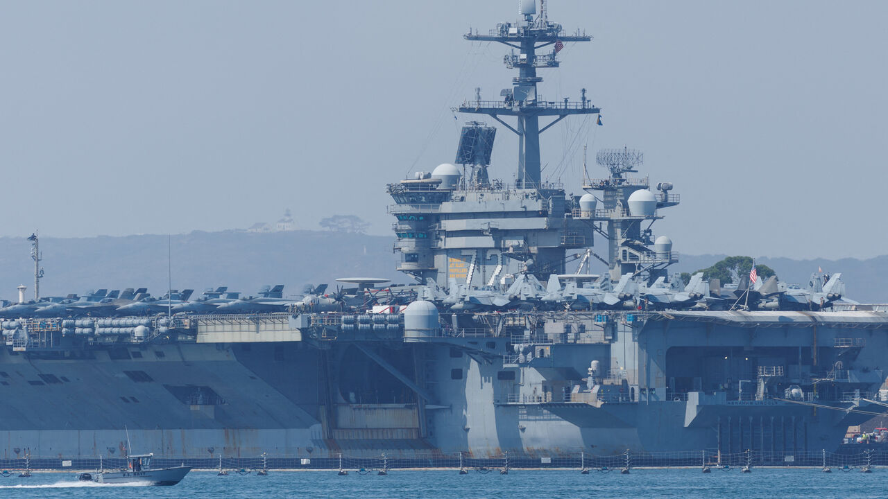 The USS Abraham Lincoln (CVN-72), a Nimitz-class nuclear-powered aircraft carrier, at Naval Air Station North Island in San Diego, California, U.S. August 11, 2025. REUTERS/Mike Blake/File Photo