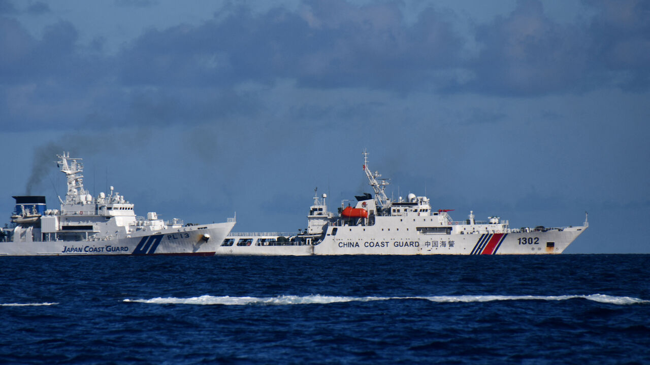 A China Coast Guard vessel sails near a Japan Coast Guard vessel around a group of disputed islands called Senkaku Islands in Japan, also known in China as Diaoyu Islands, September 14, 2025. Hitoshi Nakama/Handout via REUTERS/File Photo