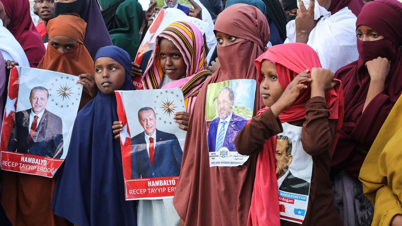 Somalis celebrate the victory of Turkish President Recep Tayyip Erdogan after he won the presidential run-off election during the celebration organized by the government in Mogadishu, on May 29, 2023.