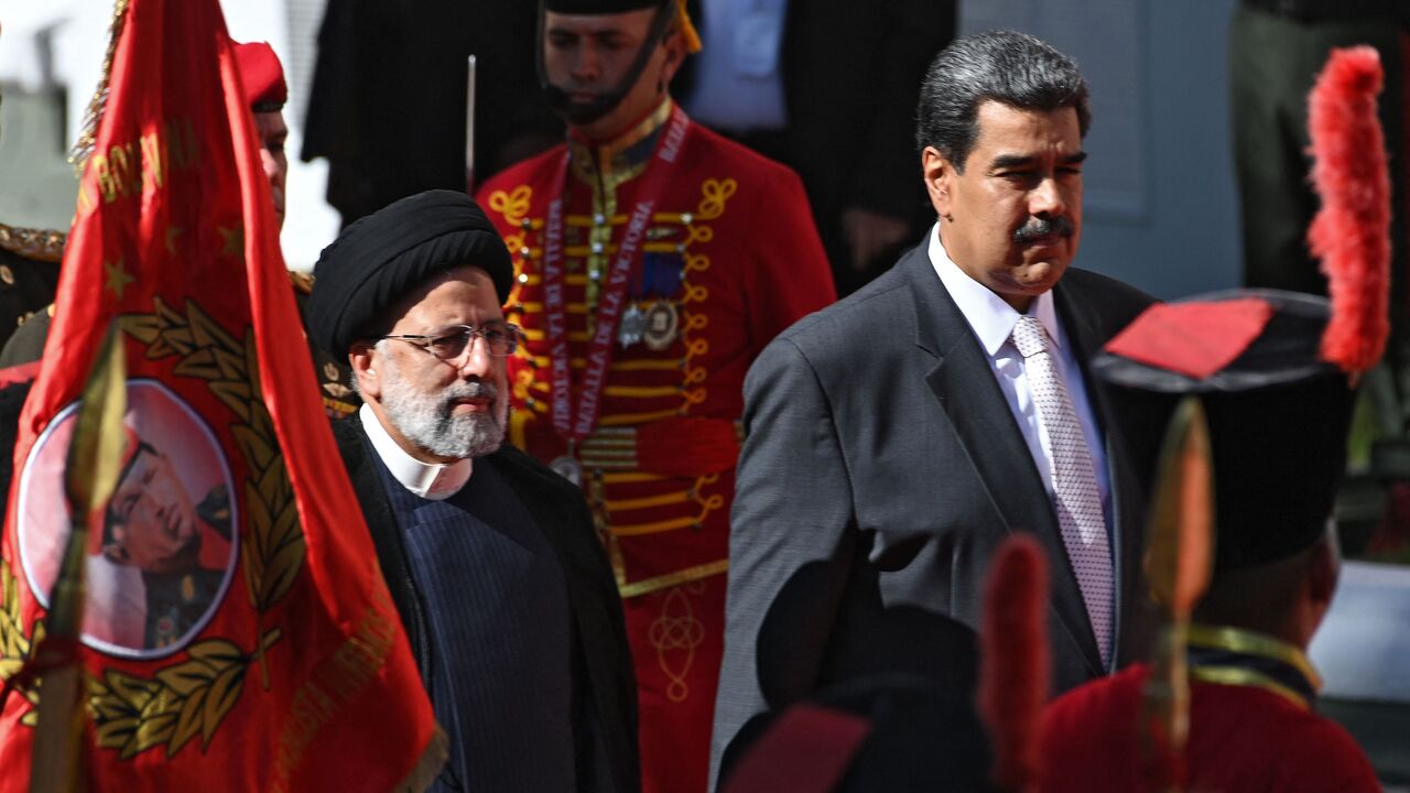 Iranian President Ebrahim Raisi (L) is welcomed by Venezuelan President Nicolas Maduro at Miraflores Presidential Palace in Caracas, on June 12, 2023. Iranian President Ebrahim Raisi arrived in Venezuela Monday for the start of a visit to "friendly countries" that also include Cuba and Nicaragua, all under sanctions from a common adversary, the United States. (Photo by Yuri CORTEZ / AFP) (Photo by YURI CORTEZ/AFP via Getty Images)
