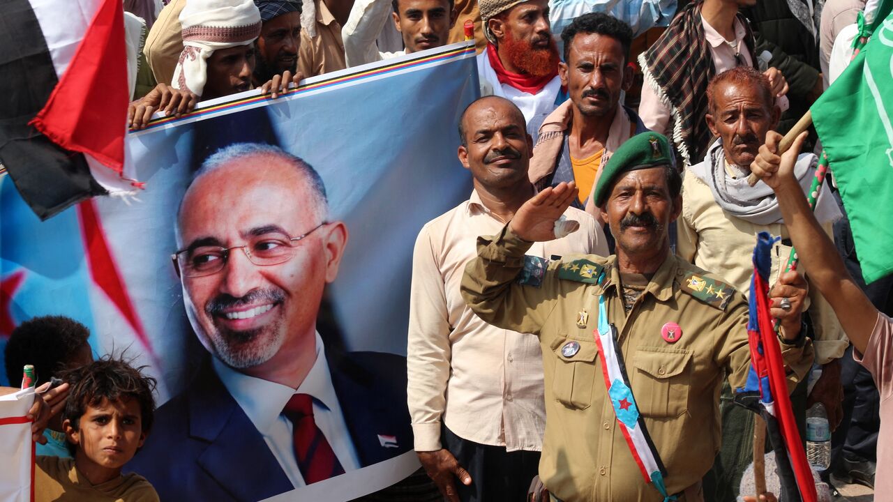 Yemeni members of the Sabahiha tribes of Lahj, who live along the strip between the south and north of the country and who support the UAE-backed Southern Transitional Council (STC), hold an image of the STC leader Aidaros Alzubidi. 