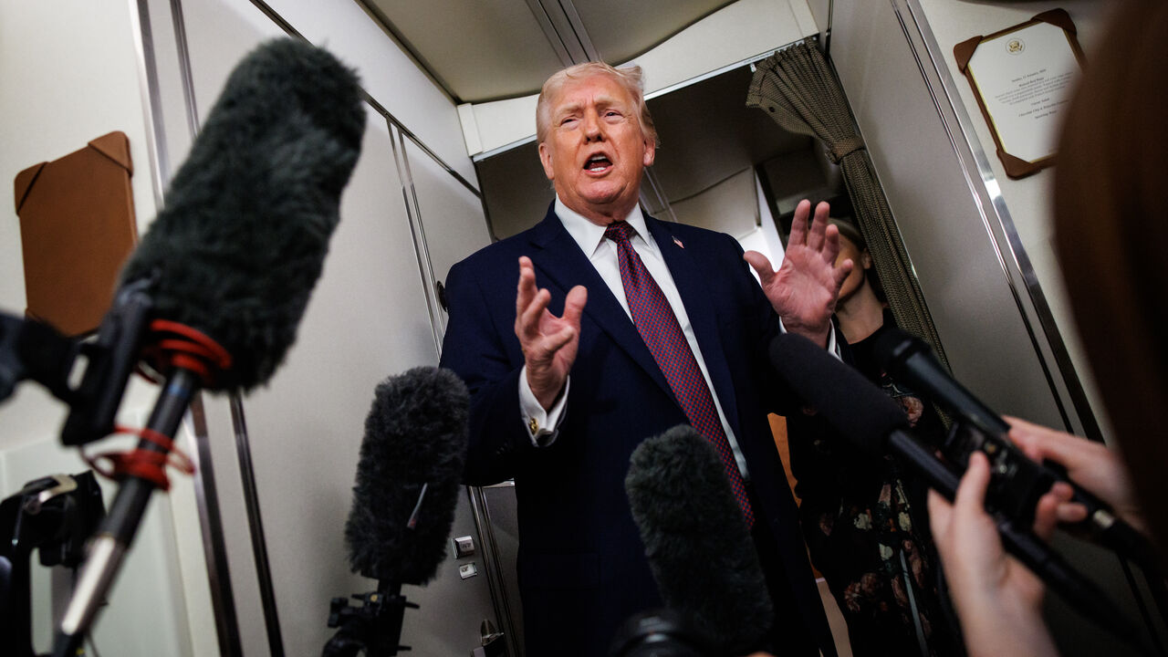 IN FLIGHT - JANUARY 11: U.S. President Donald Trump takes questions from the members of the press aboard Air Force One on January 11, 2026 en route back to the White House from Palm Beach, Florida. The President spent the weekend at his private club Mar-a-Lago in Palm Beach, Florida. (Photo by Samuel Corum/Getty Images)