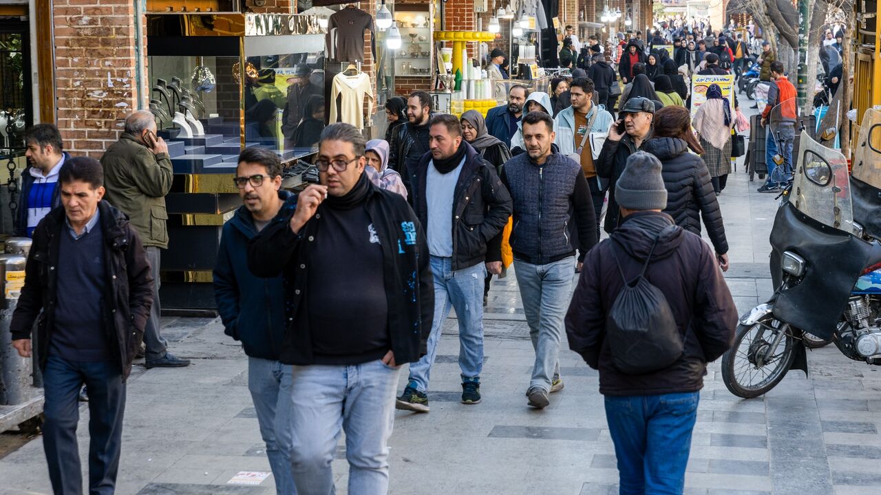 Pedestrians make their way along a path at Tehran Grand Bazaar, on Jan. 18, 2026 in Tehran, Iran. 