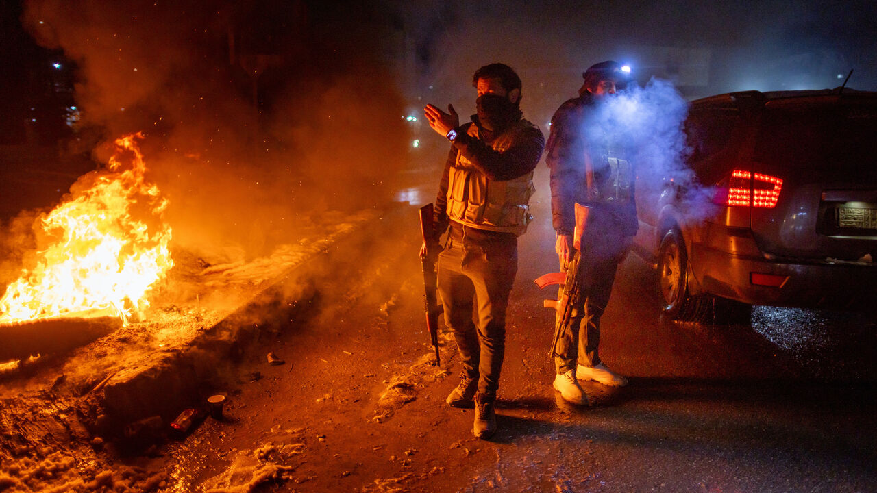 Kurdish security forces patrol the street on Jan. 23, 2026 in Qamishli, Syria. 