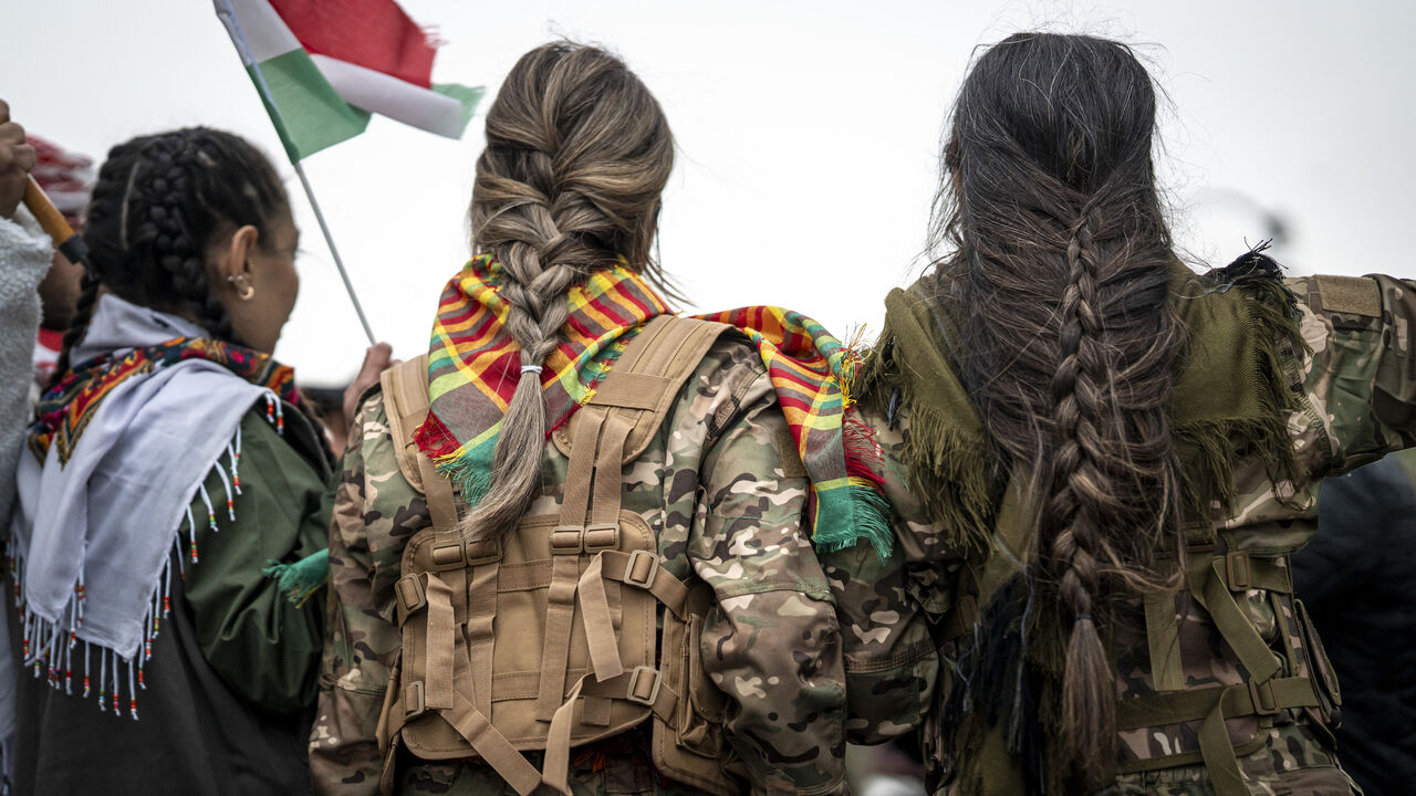 A woman with braided hair during a solidarity demonstration in Erbil, Iraq's Kurdistan region, on Jan. 23, 2026. 