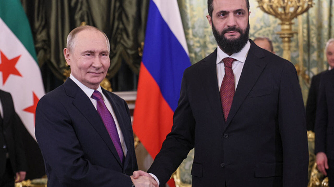 Russian President Vladimir Putin and Syria's President Ahmed al-Sharaa shake hands during a meeting at the Kremlin in Moscow on January 28, 2026. (MAXIM SHIPENKOV / AFP via Getty Images)