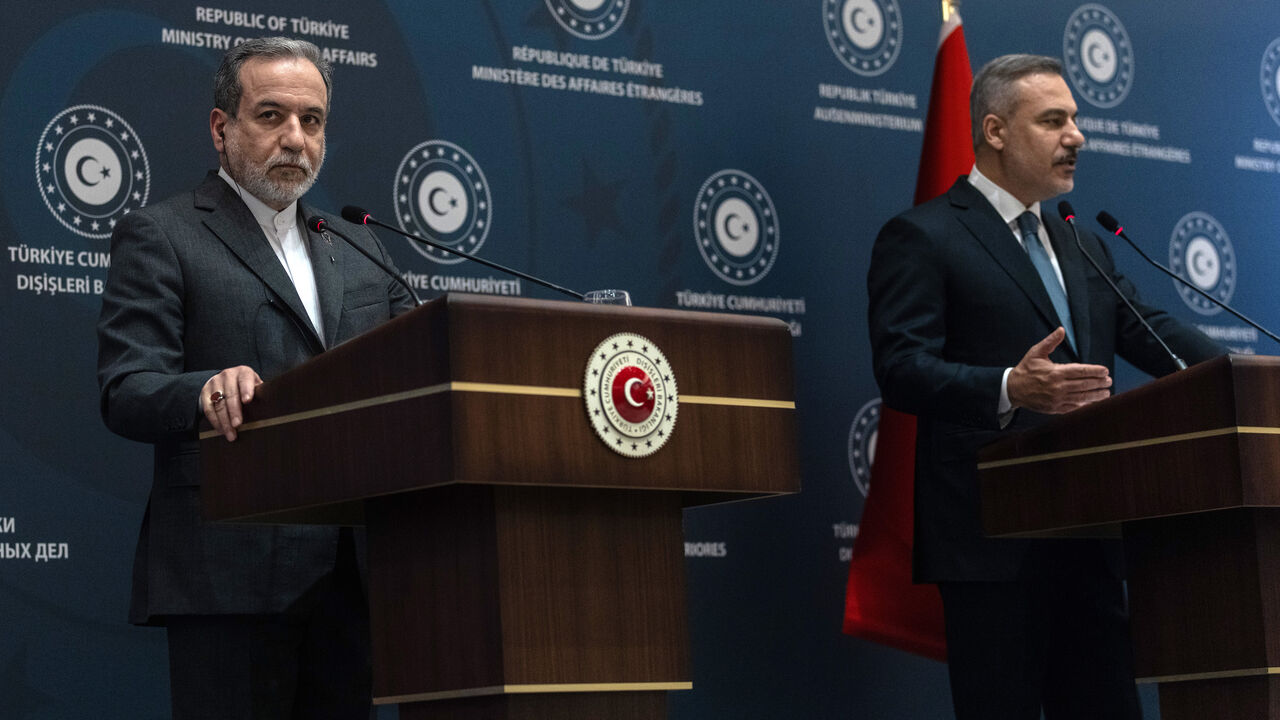 Turkey's Foreign Minister Hakan Fidan (R) and his Iranian counterpart Abbas Araghchi (L) give a statement at the Ritz Hotel as they meet on Jan. 30, 2026 in Istanbul, Turkey. 
