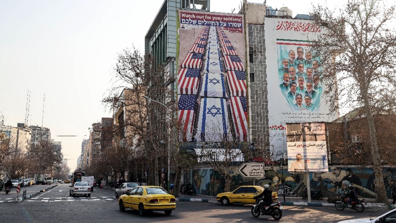 An anti-US and anti-Israel banner is displayed in Iran, which has warned against American military intervention over a deadly crackdown on protests