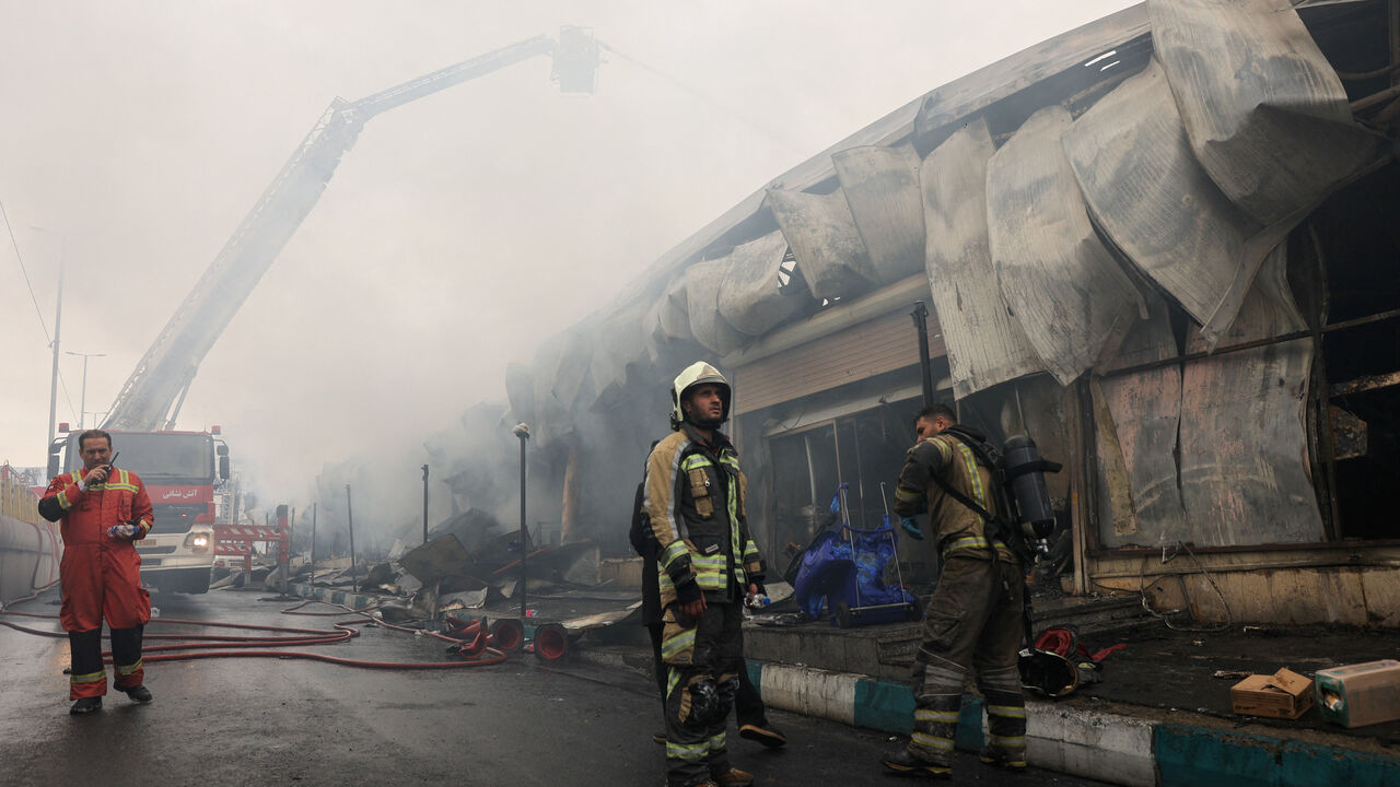 Firefighters work at the scene of a fire at Janat Abad Market in Tehran, Iran, February 3, 2026. Majid Asgaripour/WANA (West Asia News Agency) via REUTERS
