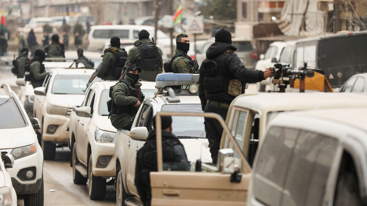 Members of the Kurdish Internal Security Forces wait for the arrival of the security forces of the Syrian government during the curfew, following an agreement between the Syrian Democratic Forces and the Syrian government, in Qamishli, Syria, February 3, 2026. REUTERS/Orhan Qereman