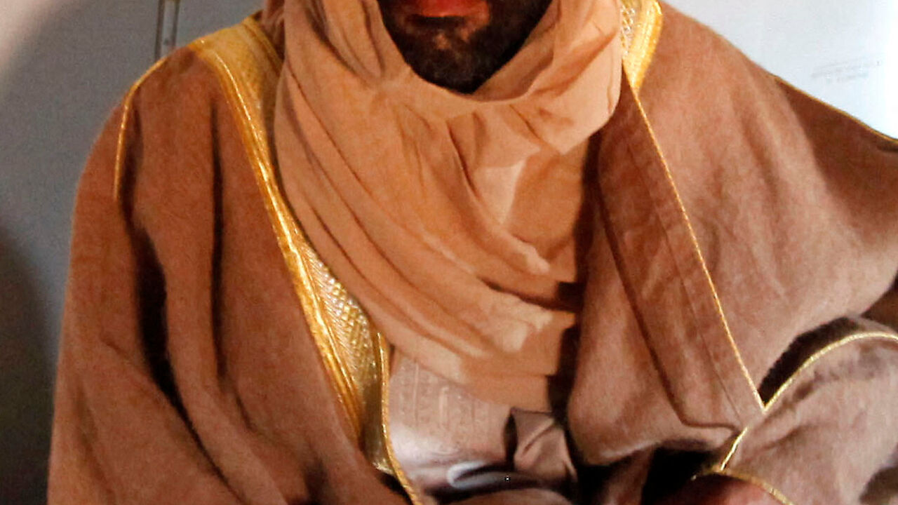 FILE PHOTO: Saif al-Islam Gaddafi is pictured sitting in a plane in Zintan November 19, 2011.  REUTERS/Ismail Zitouny/File Photo
