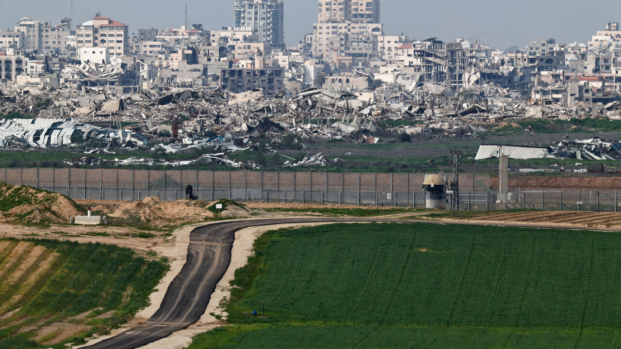 A field on the Israeli side of the Israel-Gaza border in southern Israel, January 21, 2026. Destruction in Gaza can be seen in the background. REUTERS/Amir Cohen