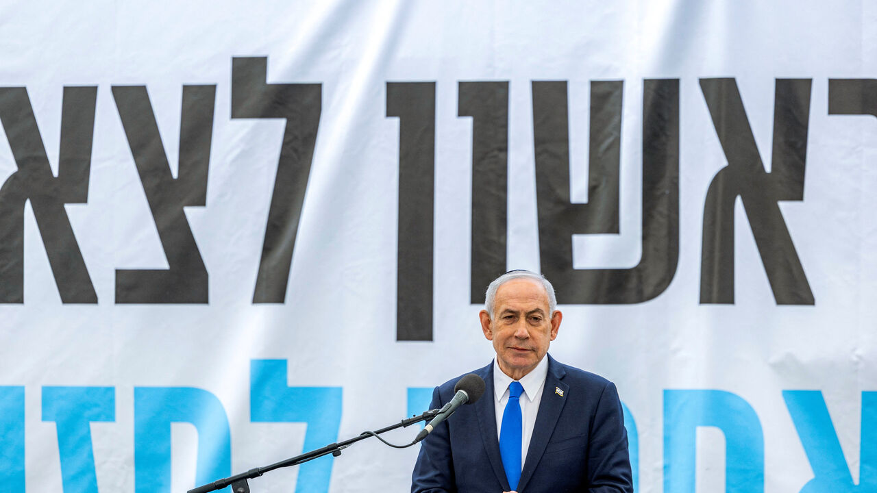 Israel's Prime Minister Benjamin Netanyahu speaks during the funeral of Israeli hostage Ran Gvili, an off-duty police officer who was killed fighting militants that had infiltrated Israel during the deadly October 7, 2023, attack by Hamas, and the last hostage recovered from Gaza whose remains were finally brought back to Israel on January 26, in the southern town of Meitar, Israel January 28, 2026.   CHAIM GOLDBERG/Pool via REUTERS