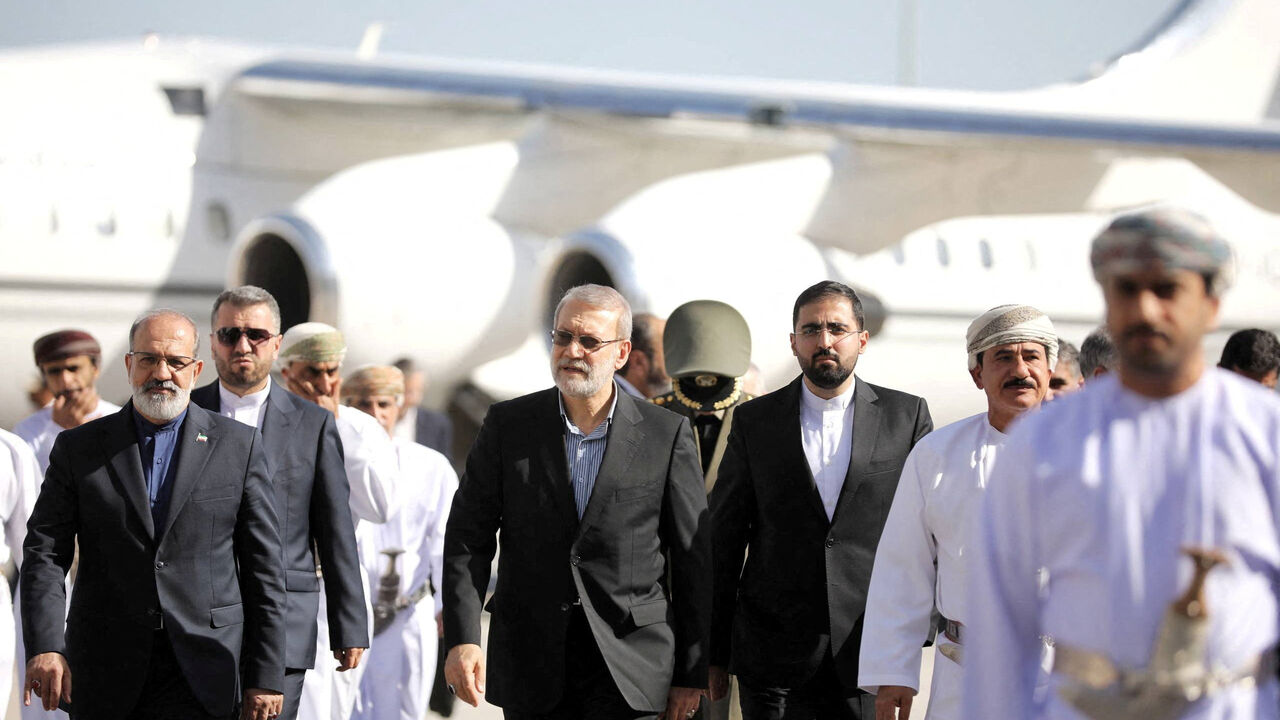 Secretary of the National Security Council, Ali Larijani is welcomed by the Minister of the Royal Office in the Sultanate of Oman, Sultan bin Mohammed al Numani, upon his arrival in Muscat, Oman, February 10, 2026. Iran's National Security Council/WANA (West Asia News Agency)/Handout via REUTERS