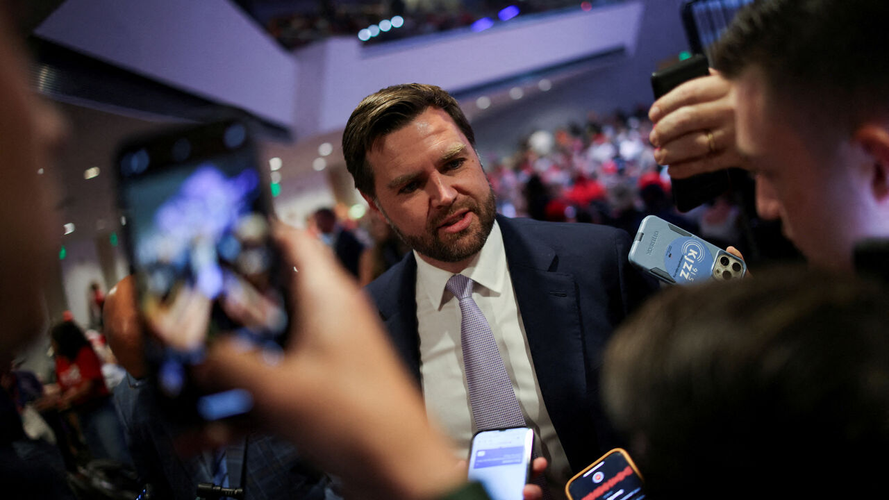 U.S. Senator J. D. Vance (R-OH) speaks to the media before a Turning Point USA event at the Dream City Church in Phoenix, Arizona, U.S., June 6, 2024. REUTERS/Carlos Barria